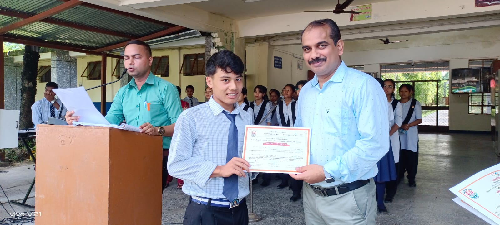 student receiving certificate